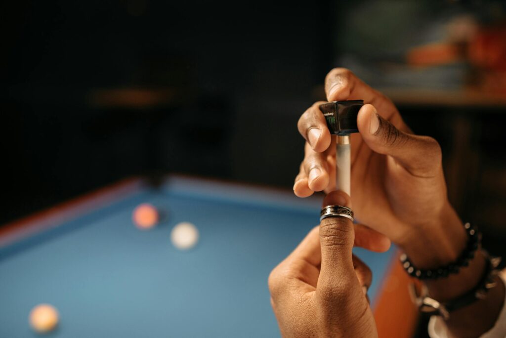 Applying chalk to a cue