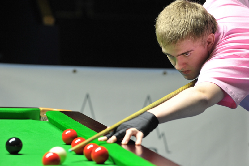 Player wearing snooker gloves